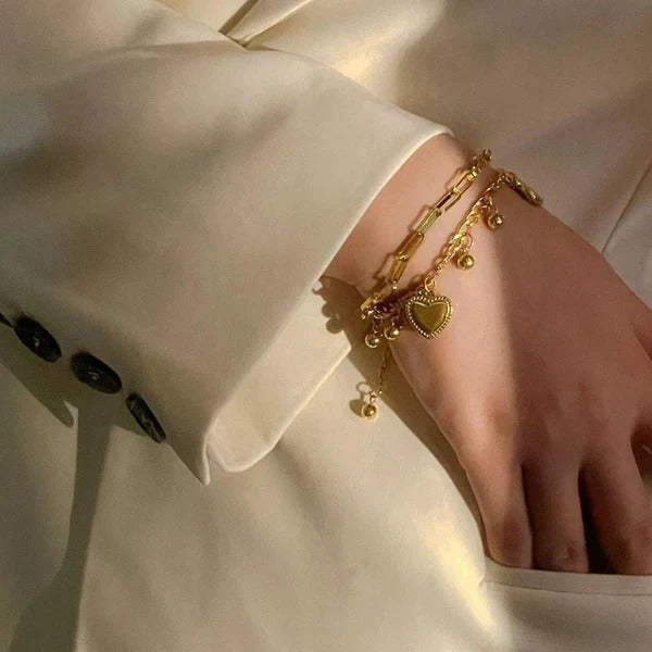 Our Heart Charm Layered Bracelet is made to sparkle, stack & steal hearts