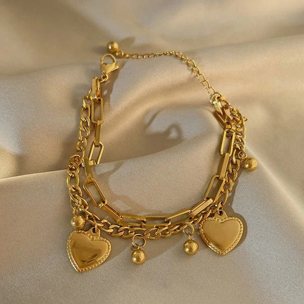 Our Heart Charm Layered Bracelet is made to sparkle, stack & steal hearts