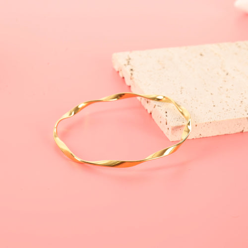 Minimalist Twisted Gold Bangle.