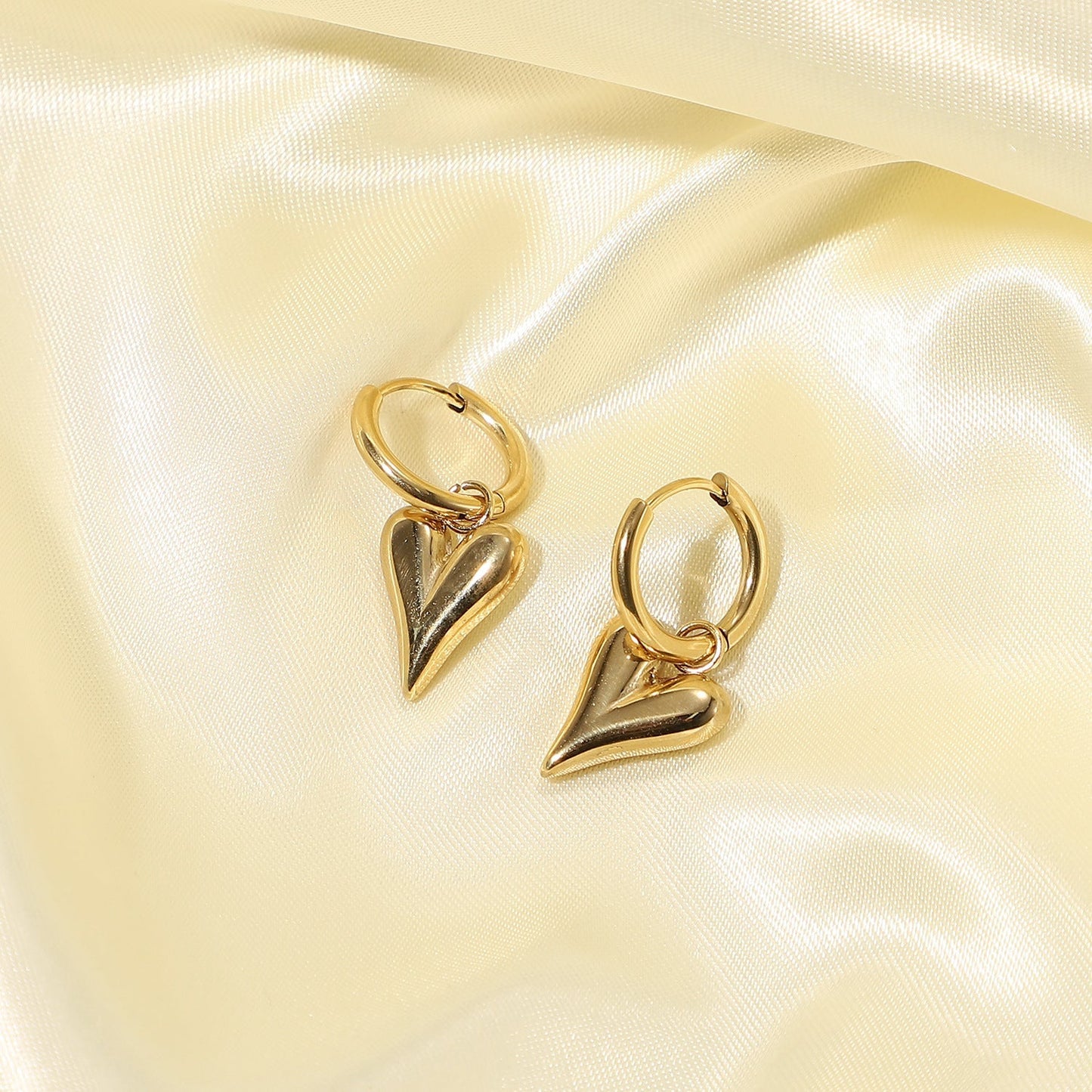 Elegant Hoop Earrings with Heart Pendants