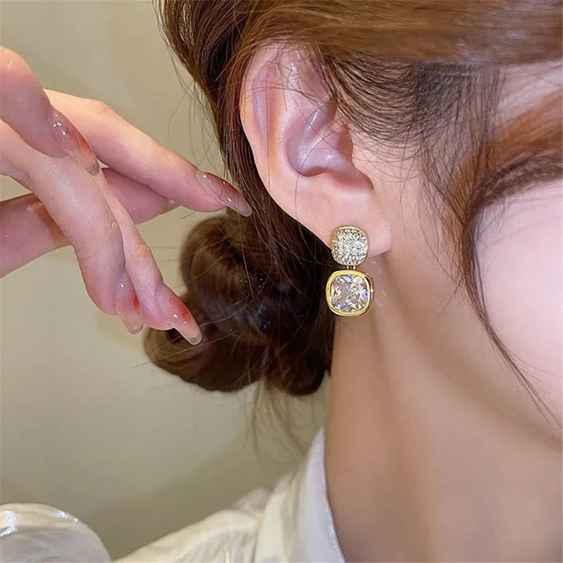 Elegant Earrings With Square Cut Design