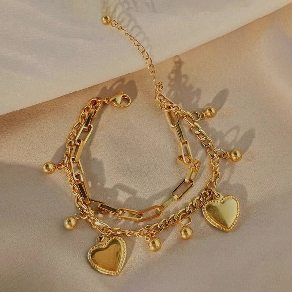 Our Heart Charm Layered Bracelet is made to sparkle, stack & steal hearts