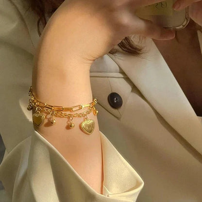 Our Heart Charm Layered Bracelet is made to sparkle, stack & steal hearts