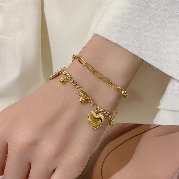 Our Heart Charm Layered Bracelet is made to sparkle, stack & steal hearts