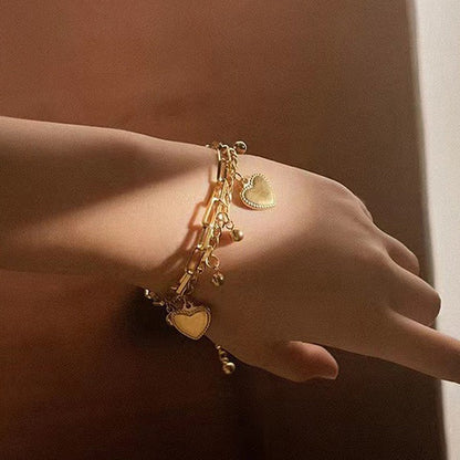 Our Heart Charm Layered Bracelet is made to sparkle, stack & steal hearts