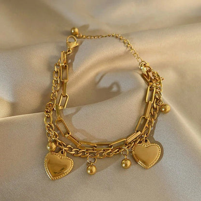Our Heart Charm Layered Bracelet is made to sparkle, stack & steal hearts
